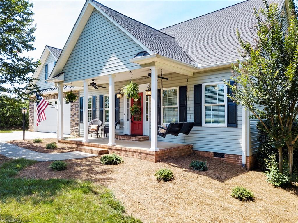 125 East Rollingmeadow Road Advance, NC 27006 - Photo 1 of 30 This charming front porch says, "Welcome Home!"