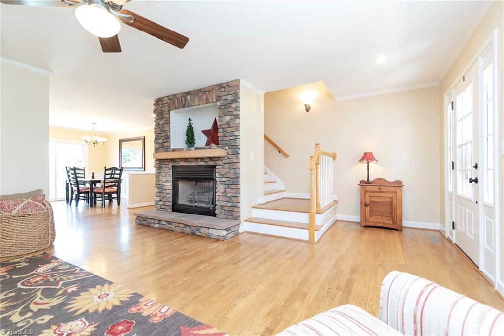125 East Rollingmeadow Road Advance, NC 27006 - Photo 5 of 30 Beautiful hardwood floors. Stacked stone fireplace with gas logs. So much natural light!