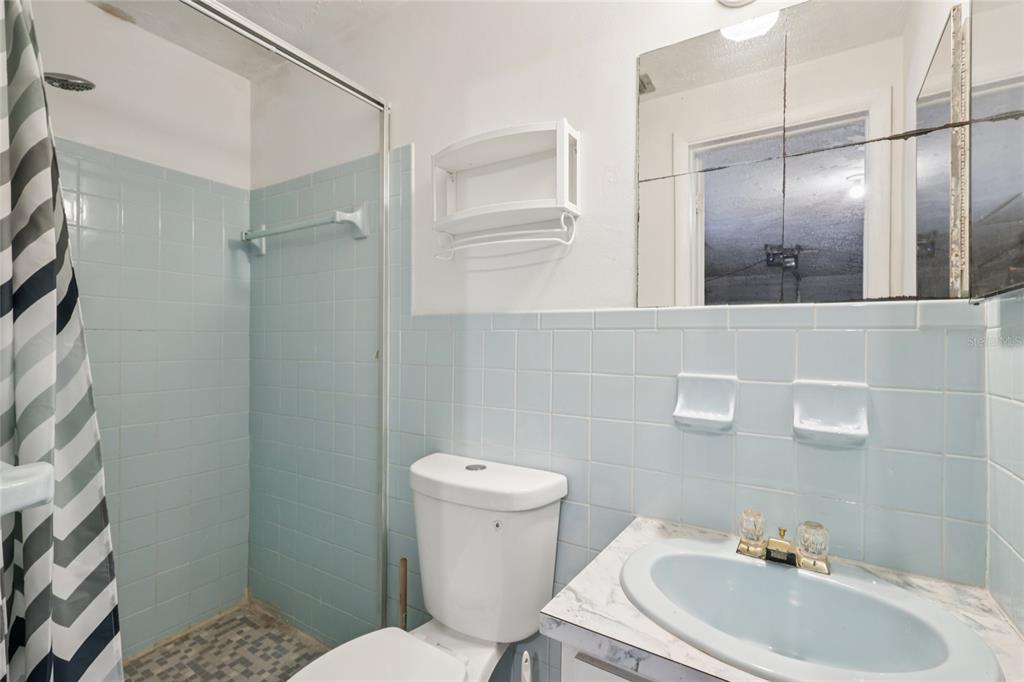 3548 Darlington Road Holiday, FL 34691 - Photo 27 of 32 a bathroom with a sink toilet and shower