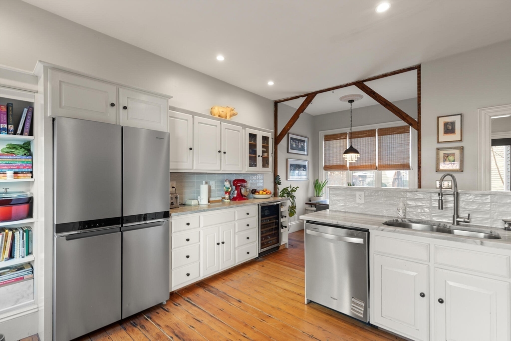 16 Williams Street Salem, MA 01970 - Photo 12 of 29 a kitchen with granite countertop a refrigerator and a sink