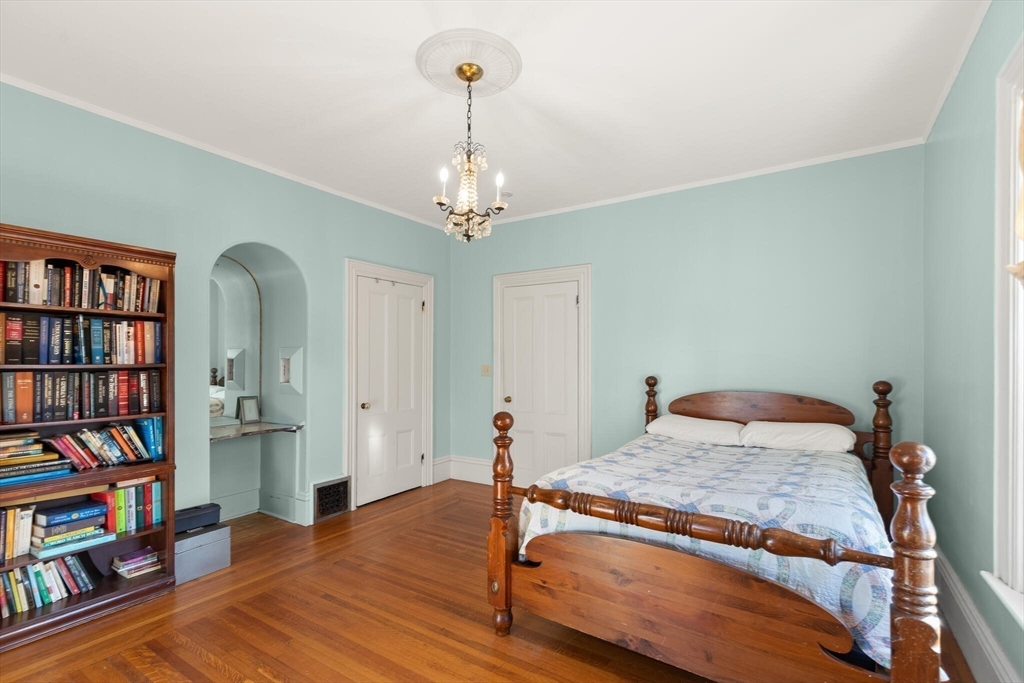 16 Williams Street Salem, MA 01970 - Photo 17 of 29 a bedroom with a bed and a book shelf