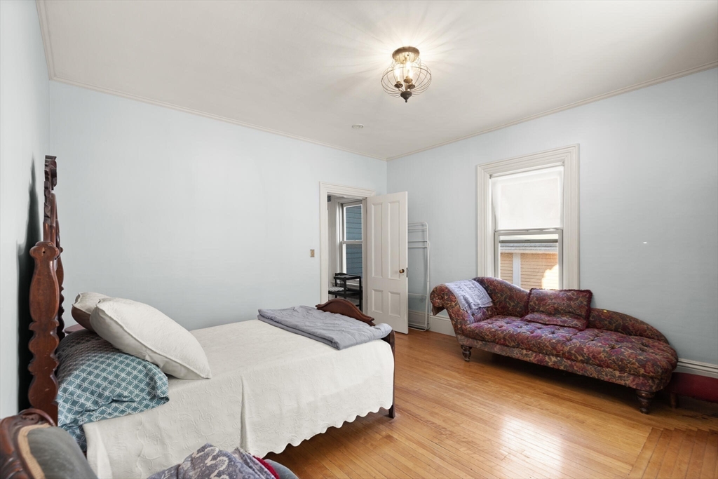 16 Williams Street Salem, MA 01970 - Photo 19 of 29 a spacious bedroom with a bed and window