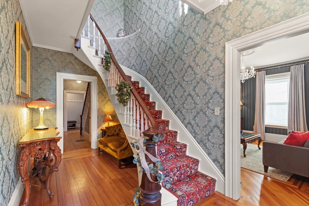 16 Williams Street Salem, MA 01970 - Photo 5 of 29 a view of an entryway with wooden floor windows and a livingroom