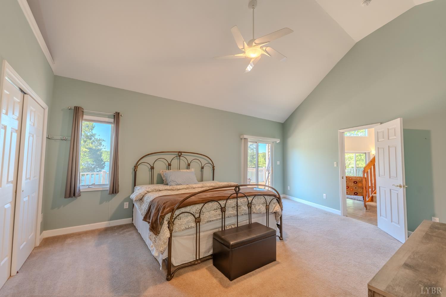 1269 Runaway Bay Road Lynch Station, VA 24571 - Photo 23 of 82 a bedroom with a bed and a chandelier
