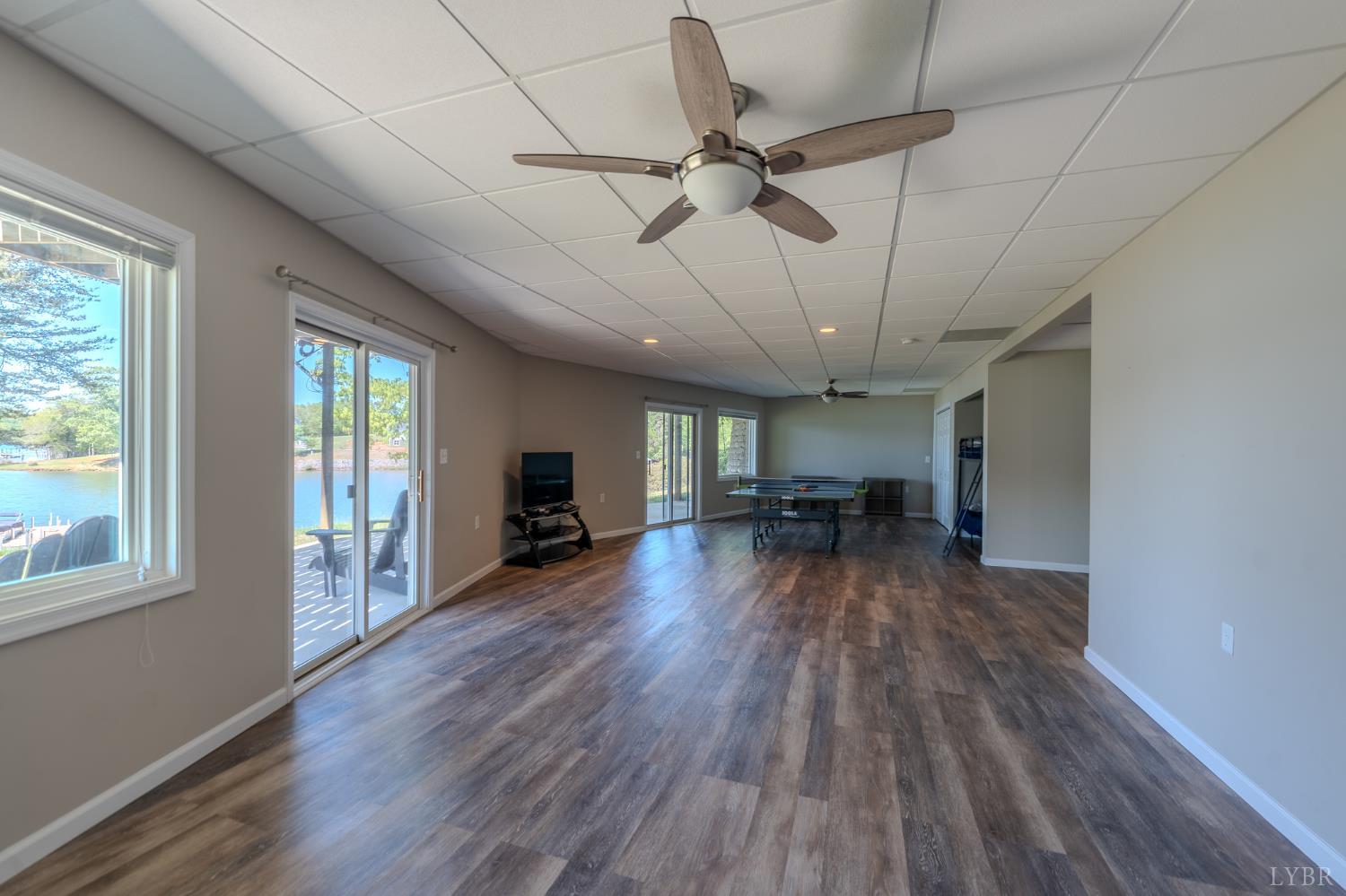 1269 Runaway Bay Road Lynch Station, VA 24571 - Photo 36 of 82 a view of a livingroom with wooden floor and a ceiling fan