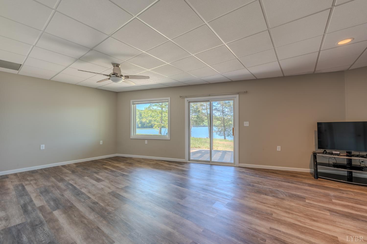 1269 Runaway Bay Road Lynch Station, VA 24571 - Photo 39 of 82 a view of an empty room with a window and wooden floor