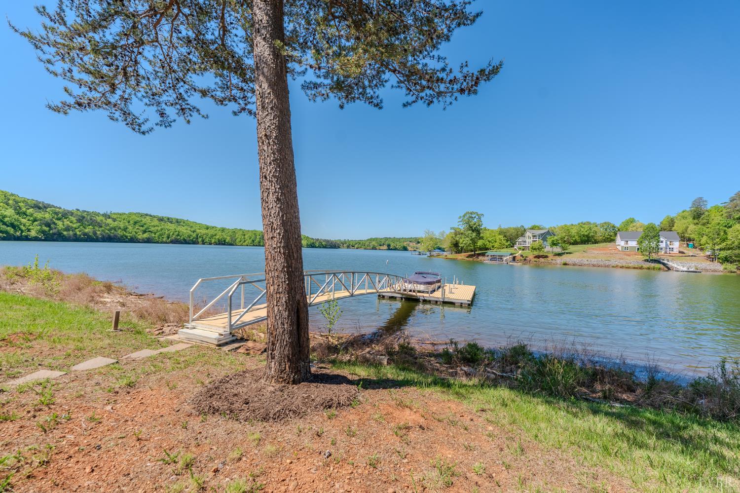 1269 Runaway Bay Road Lynch Station, VA 24571 - Photo 48 of 82 a view of a lake with a beach