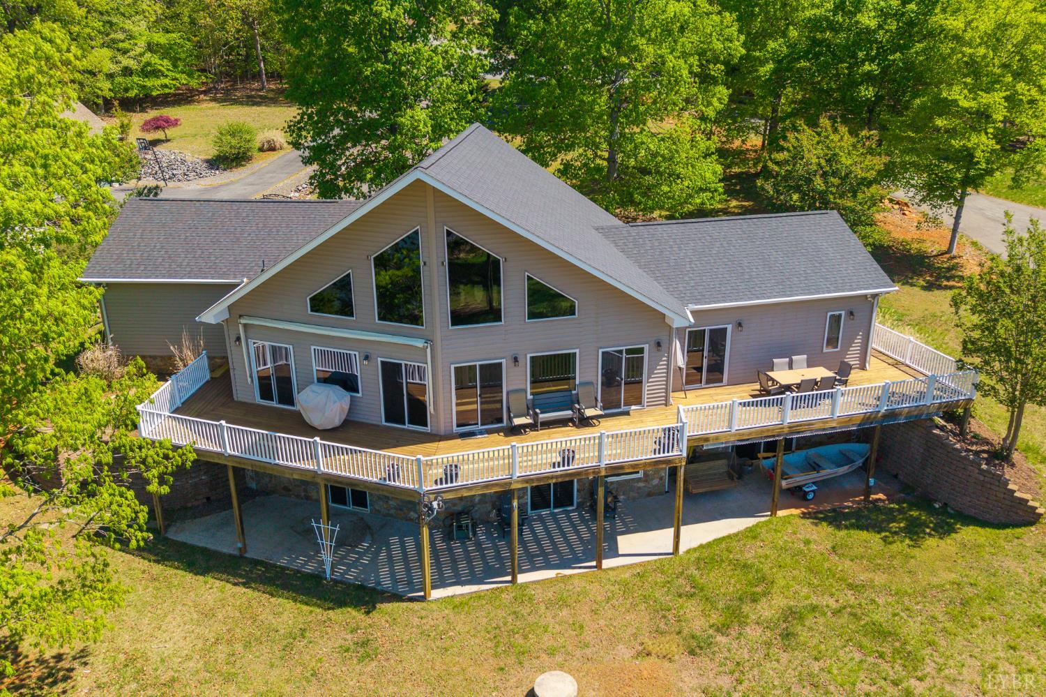 1269 Runaway Bay Road Lynch Station, VA 24571 - Photo 69 of 82 a aerial view of a house with swimming pool next to a yard