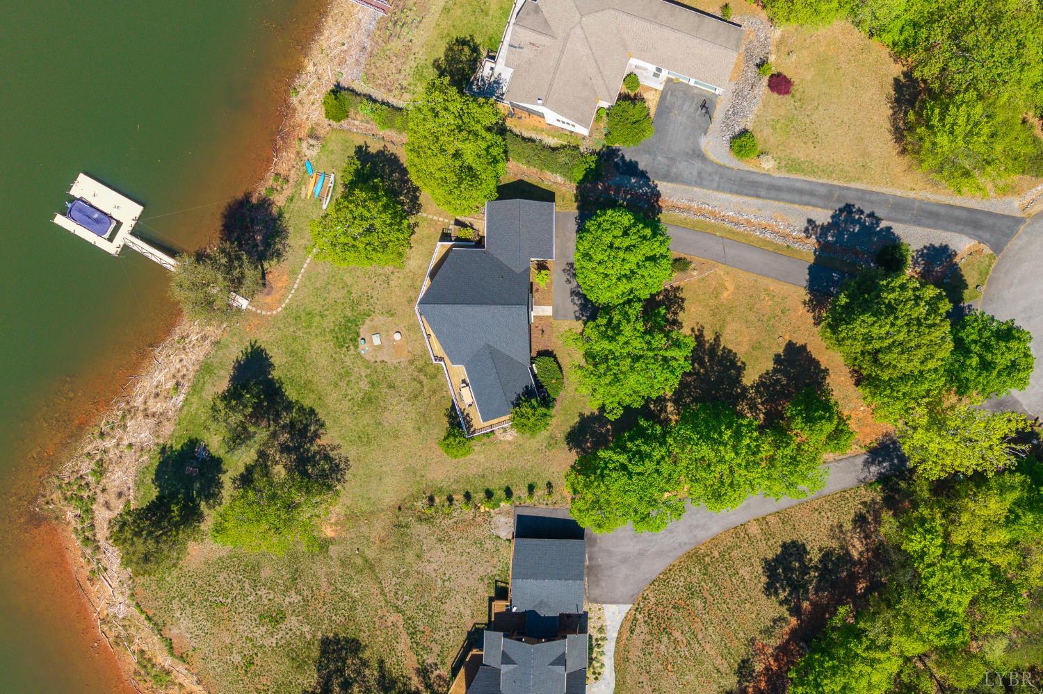 1269 Runaway Bay Road Lynch Station, VA 24571 - Photo 76 of 82 an aerial view of a house with a yard and a large pool