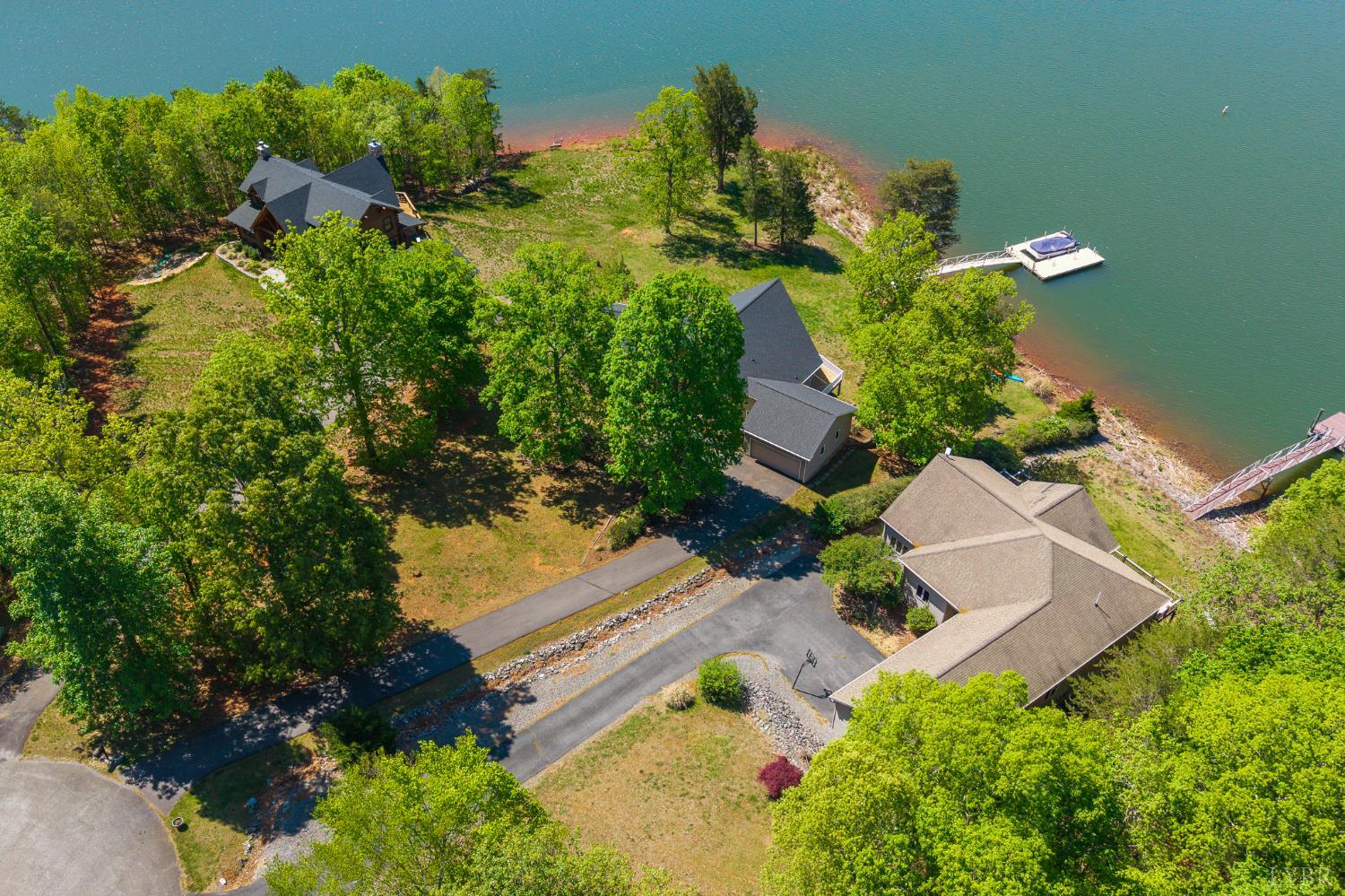 1269 Runaway Bay Road Lynch Station, VA 24571 - Photo 80 of 82 an aerial view of a house with a yard and lake view
