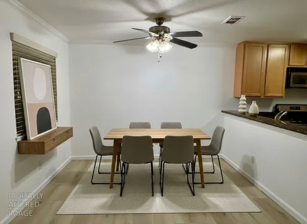 a view of a dining room with furniture