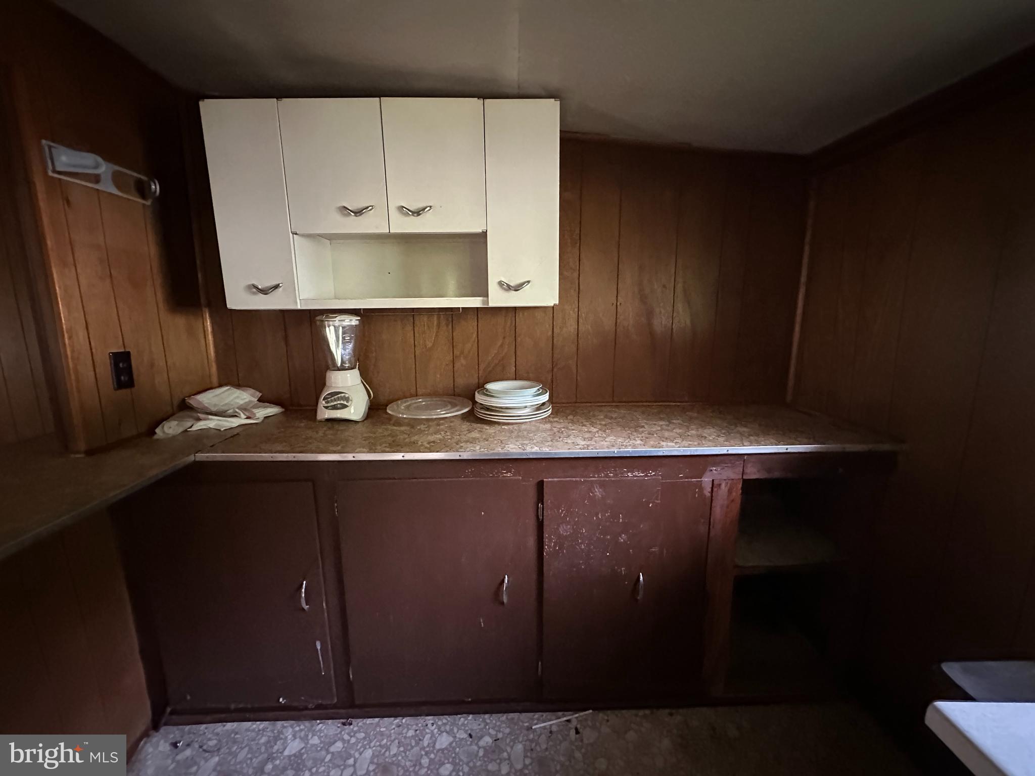 13726 Hopps Landing Road Hagerstown, MD 21740 - Photo 24 of 71 a kitchen with a sink a cabinets and wooden floor
