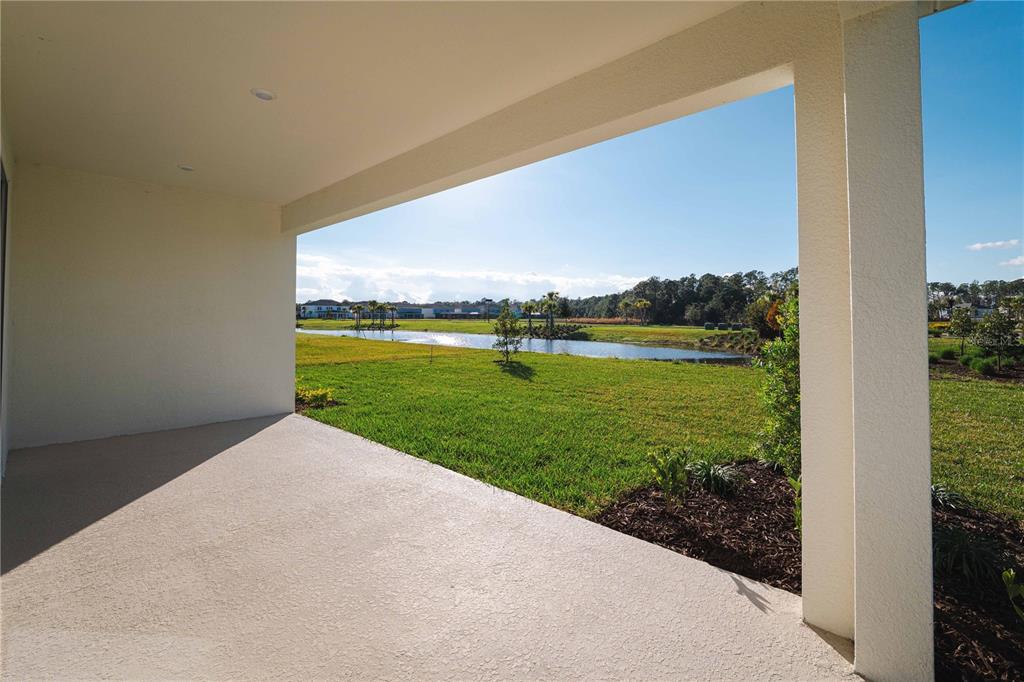 2181 Longliner Loop Wesley Chapel, FL 33543 - Photo 14 of 44 a view of a lake with a big yard