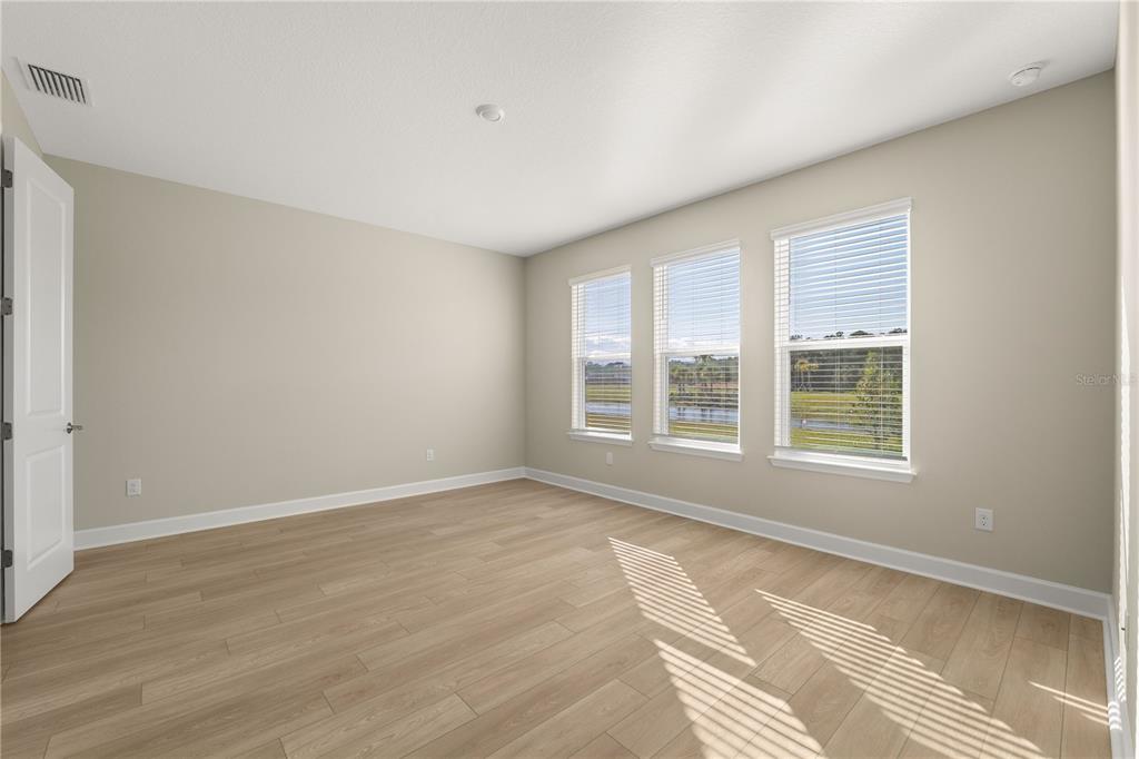 2181 Longliner Loop Wesley Chapel, FL 33543 - Photo 16 of 44 a view of an empty room with a window