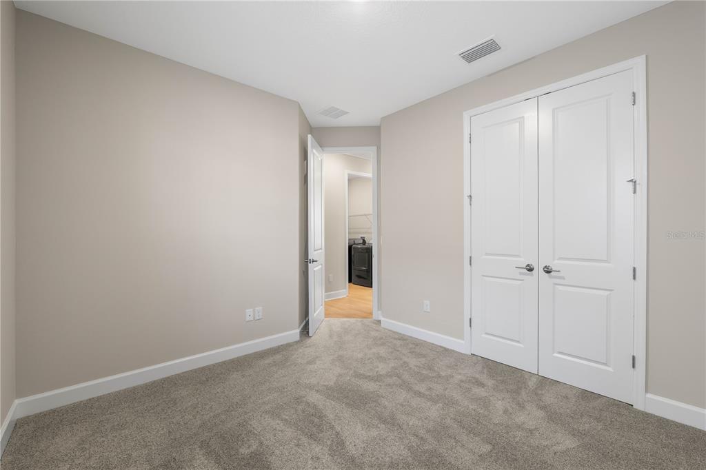 2181 Longliner Loop Wesley Chapel, FL 33543 - Photo 23 of 44 a view of an empty room and closet area