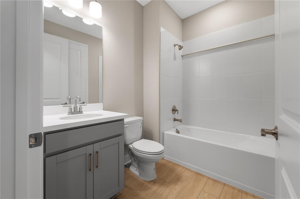 2181 Longliner Loop Wesley Chapel, FL 33543 - Photo 24 of 44 a bathroom with a sink toilet and shower