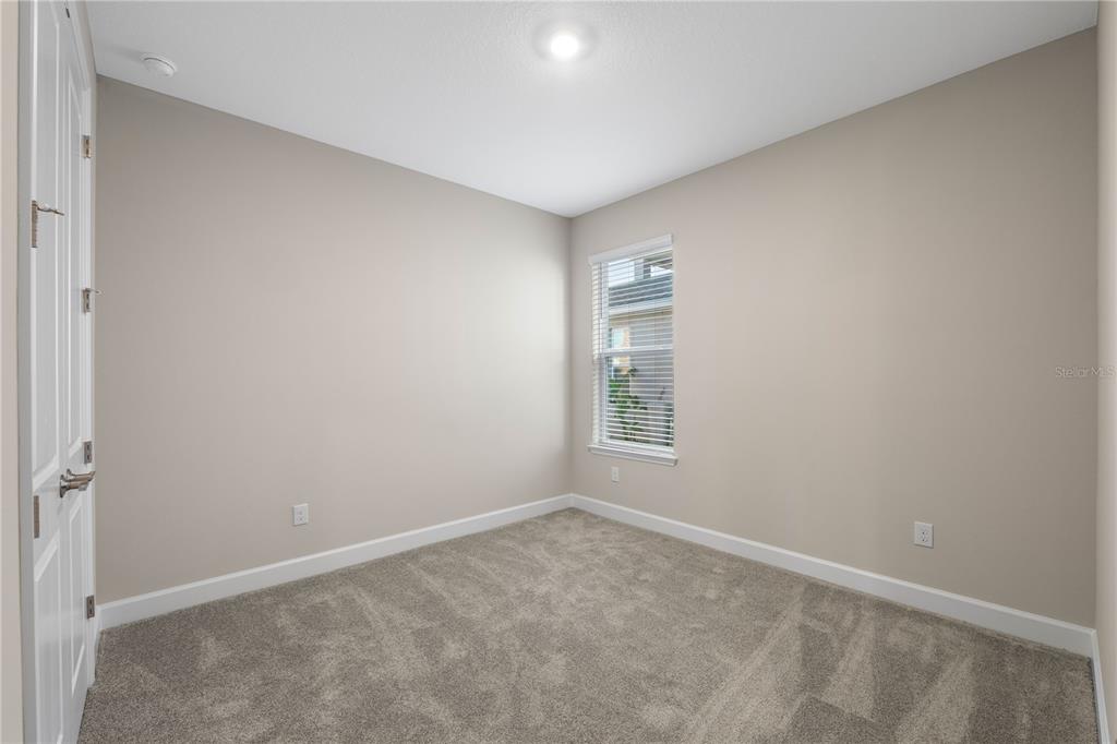 2181 Longliner Loop Wesley Chapel, FL 33543 - Photo 26 of 44 a view of an empty room with a window