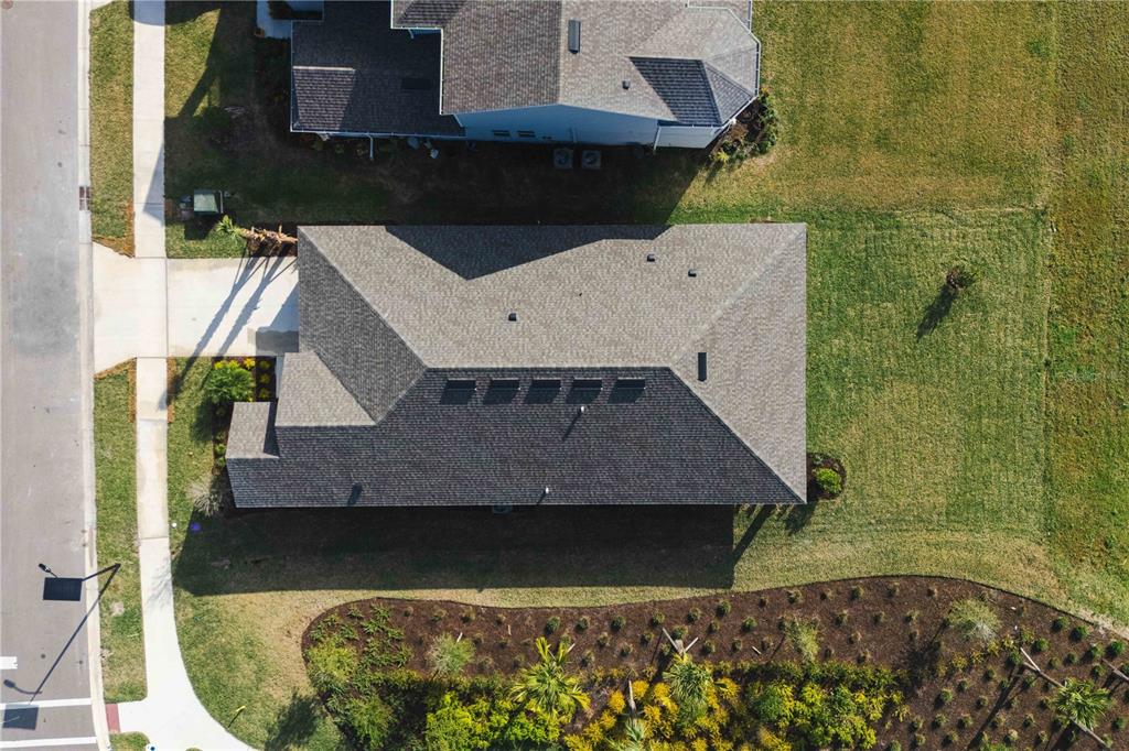 2181 Longliner Loop Wesley Chapel, FL 33543 - Photo 34 of 44 an aerial view of a house with a yard