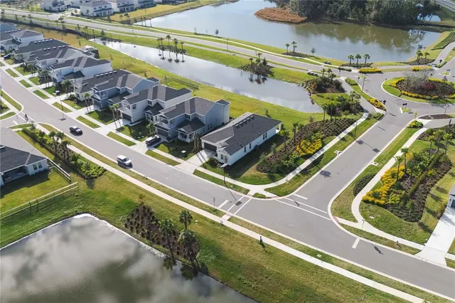 an aerial view of a house with outdoor space