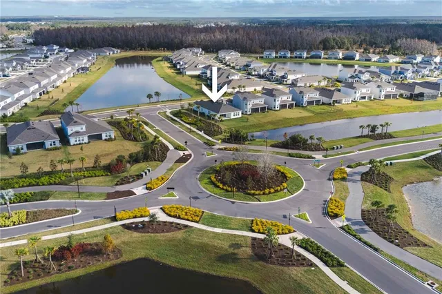 an aerial view of a house with a swimming pool