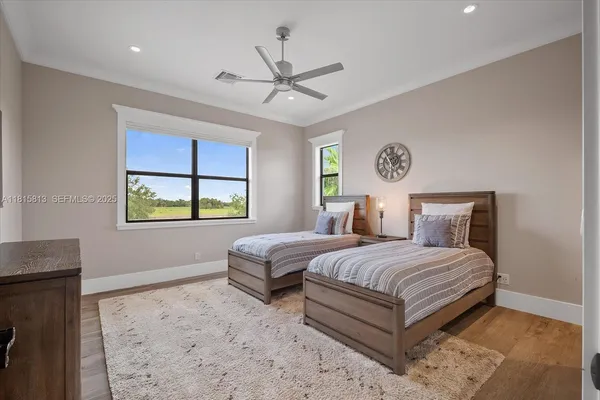 a bedroom with furniture and a rug