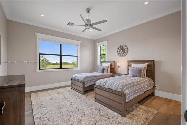a bedroom with furniture and a rug