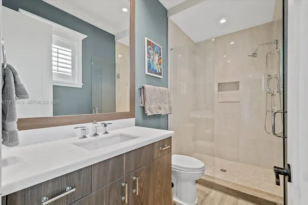 a bathroom with a sink and a window