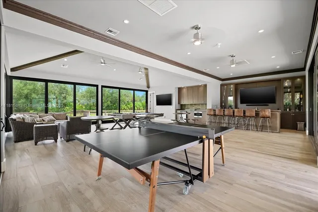 a kitchen with stainless steel appliances kitchen island granite countertop a sink and cabinets