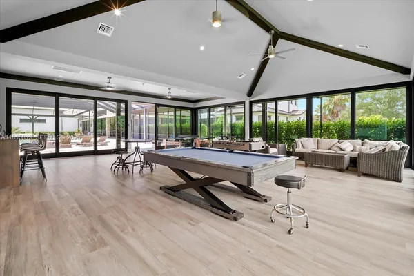 a workspace with furniture and mirror