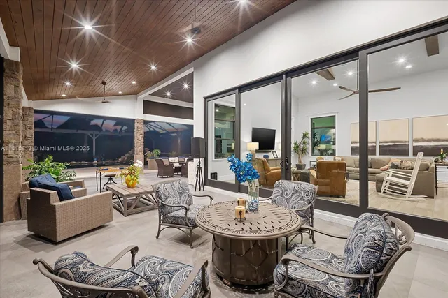 a view of a street with a sign on the wall