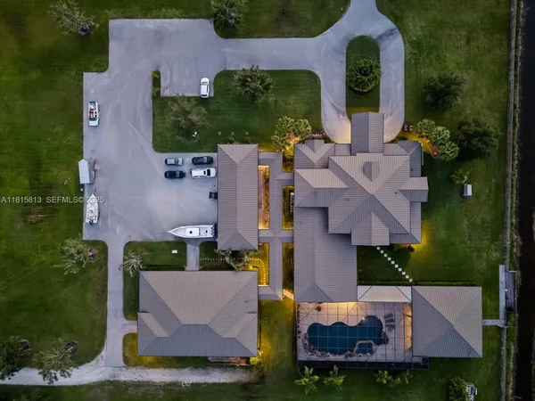 a view of a swimming pool with a yard