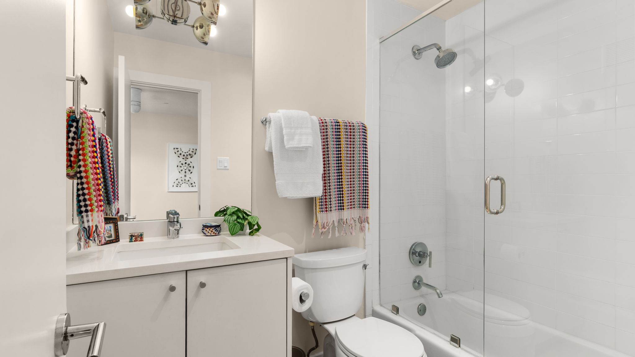 1208 Enfield Road, Unit 204 Austin, TX 78703 - Photo 13 of 21 a bathroom with a sink toilet and shower