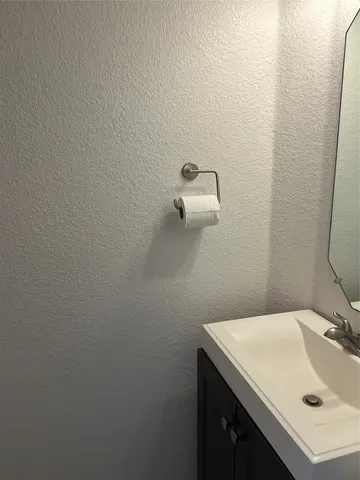 a bathroom with a sink and vanity