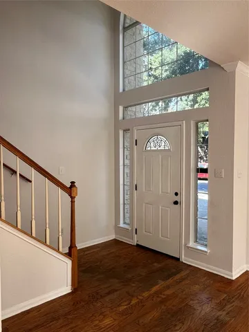 a view of front door with wooden floor