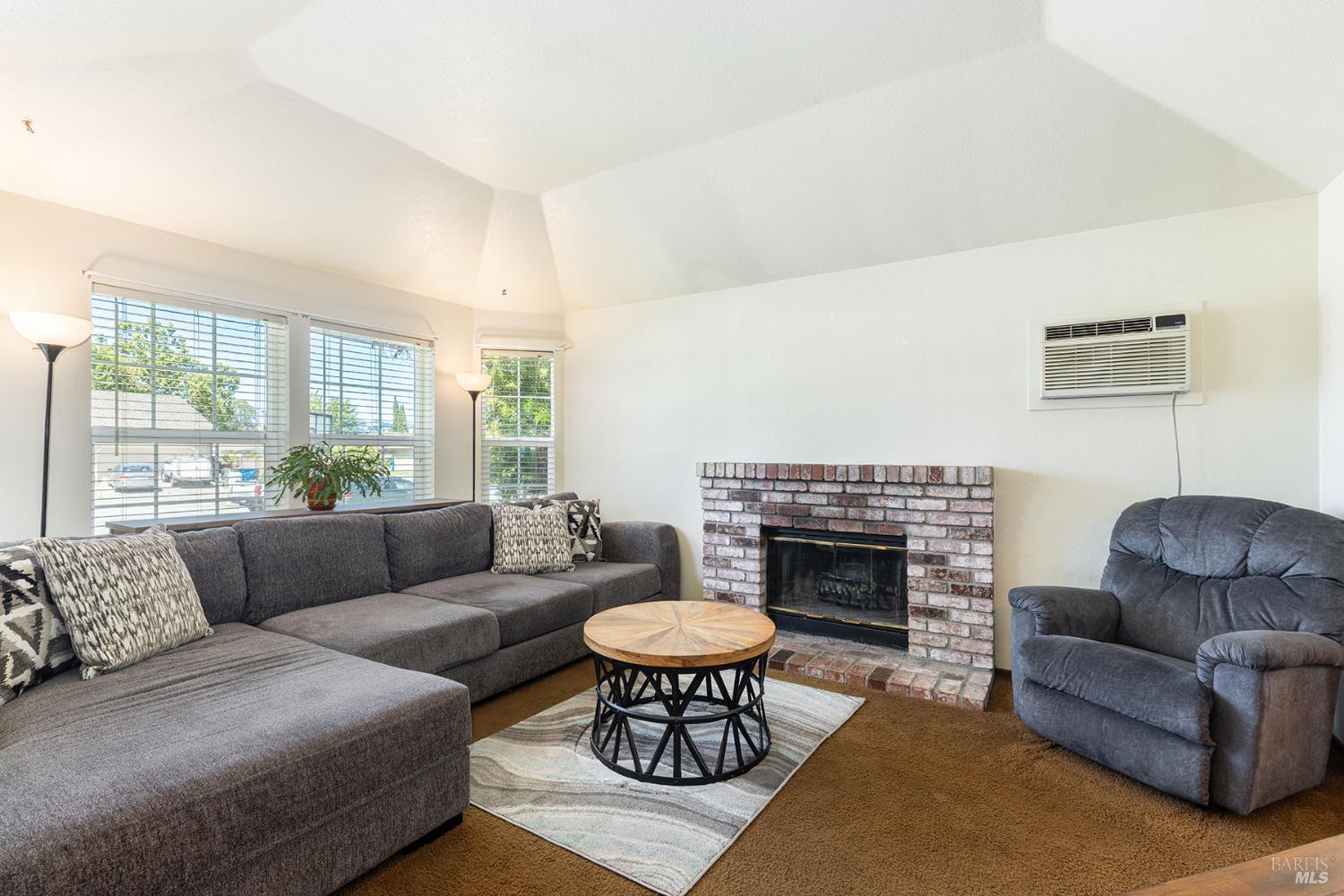 1935 Seville Street Santa Rosa, CA 95403 - Photo 23 of 30 a living room with furniture and a fireplace