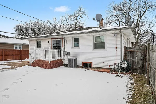 a view of a house with a snow in a yard