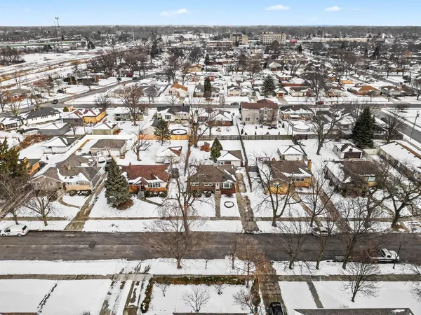 an aerial view of residential building and parking space