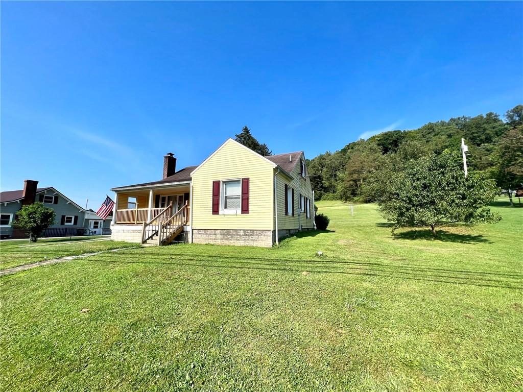 389 Mt Morris Road Mount Morris, PA 15349 - Photo 18 of 25 a view of a house with a yard