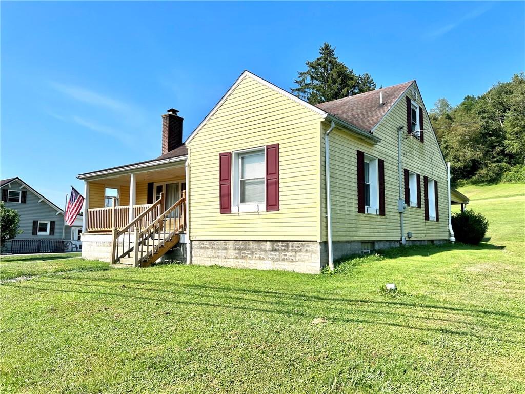 389 Mt Morris Road Mount Morris, PA 15349 - Photo 2 of 25 a view of house with backyard