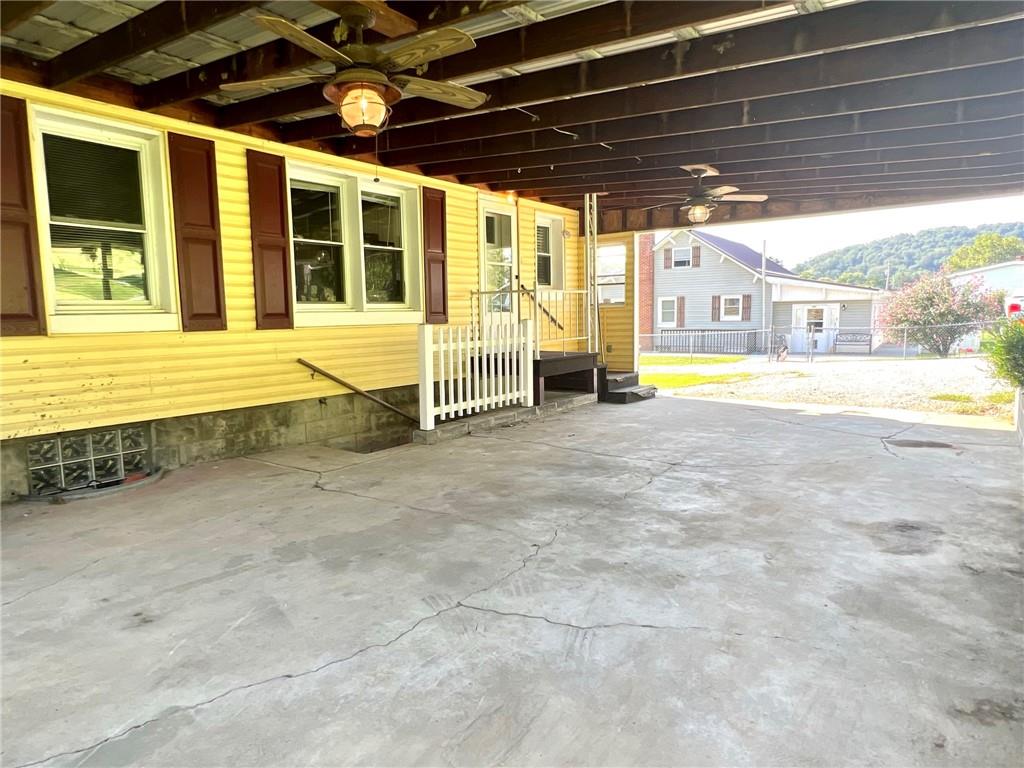 389 Mt Morris Road Mount Morris, PA 15349 - Photo 21 of 25 a view of an empty room with a patio