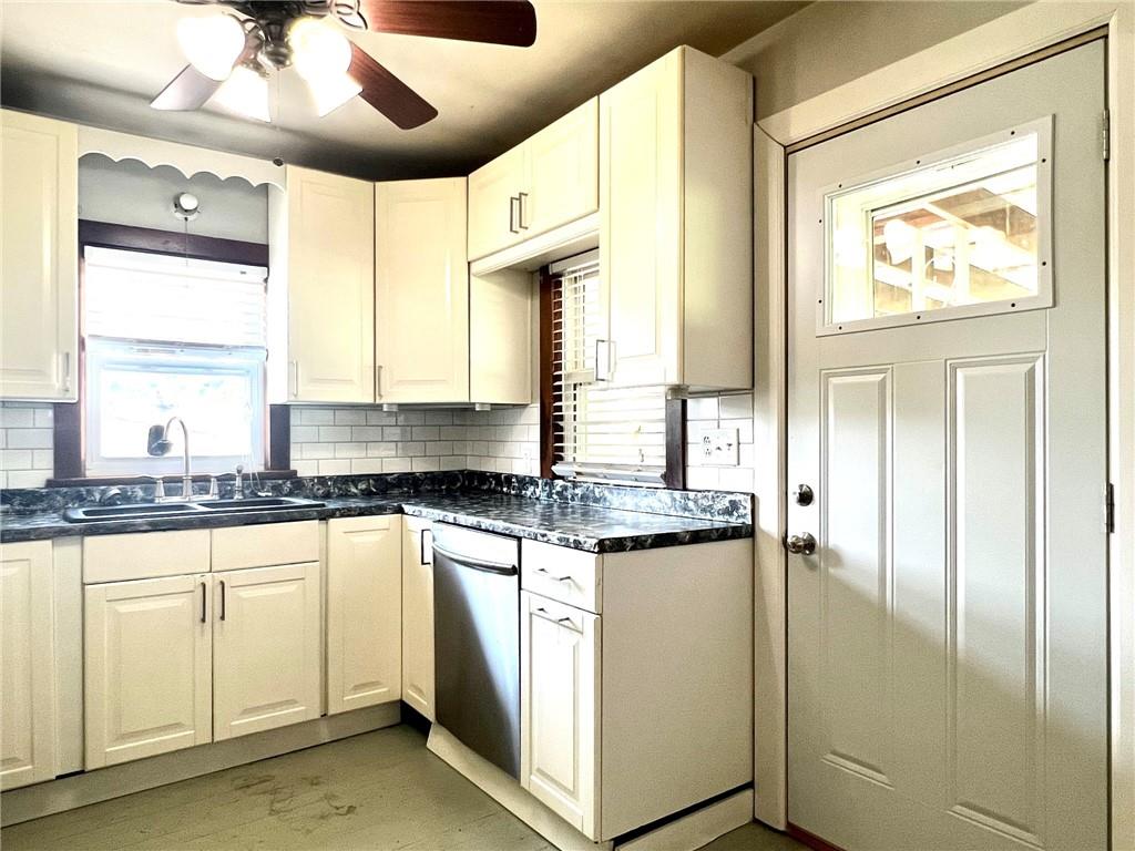 389 Mt Morris Road Mount Morris, PA 15349 - Photo 5 of 25 a kitchen with stainless steel appliances granite countertop a stove and a refrigerator