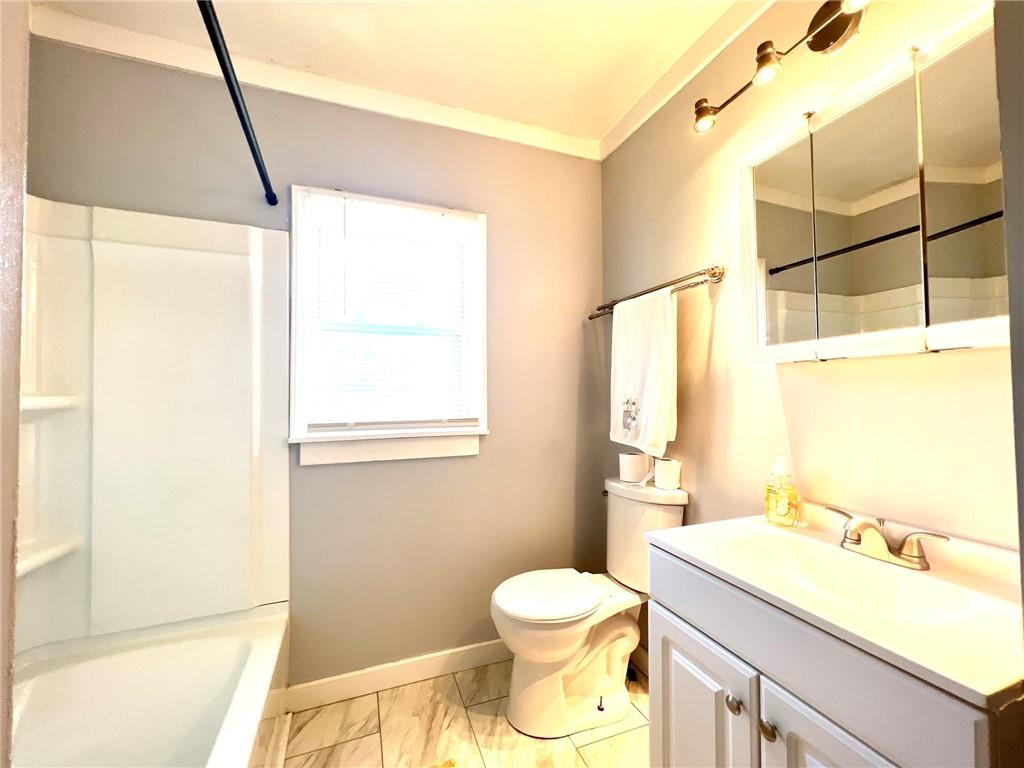 389 Mt Morris Road Mount Morris, PA 15349 - Photo 9 of 25 a bathroom with a sink a toilet and a shower