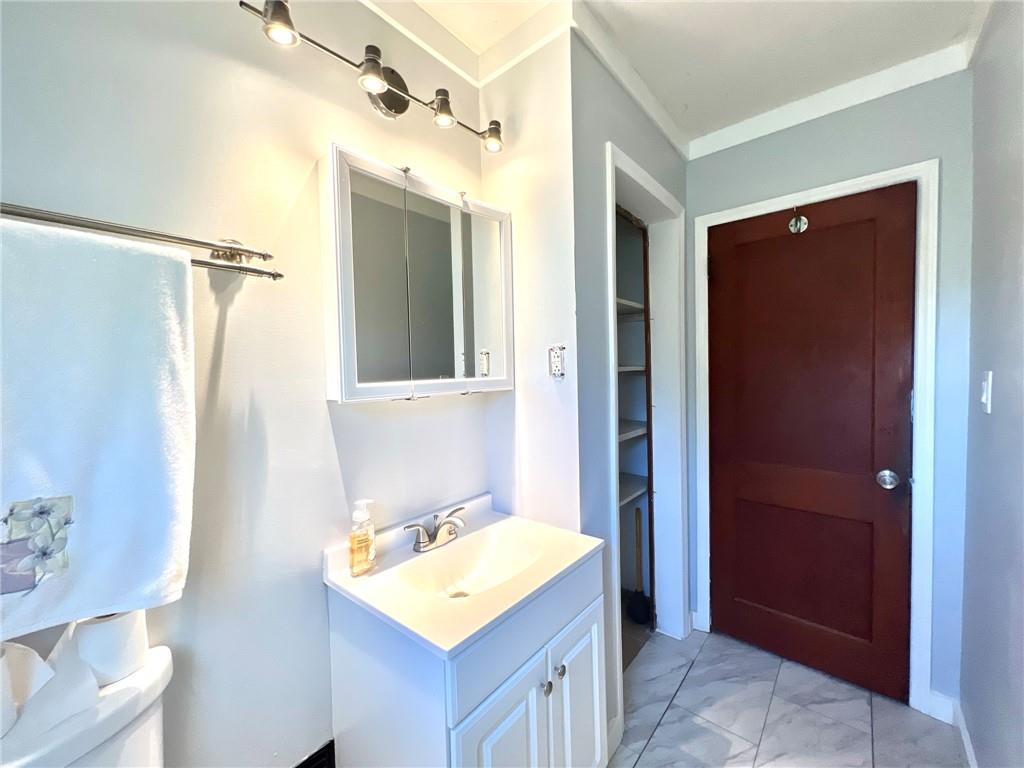 389 Mt Morris Road Mount Morris, PA 15349 - Photo 10 of 25 a bathroom with a sink a toilet and shower