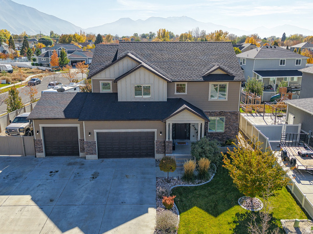 368 East 700 North Springville, UT 84663 - Photo 13 of 55 View of front of house featuring a residential view, driveway, a gate, and stone siding
