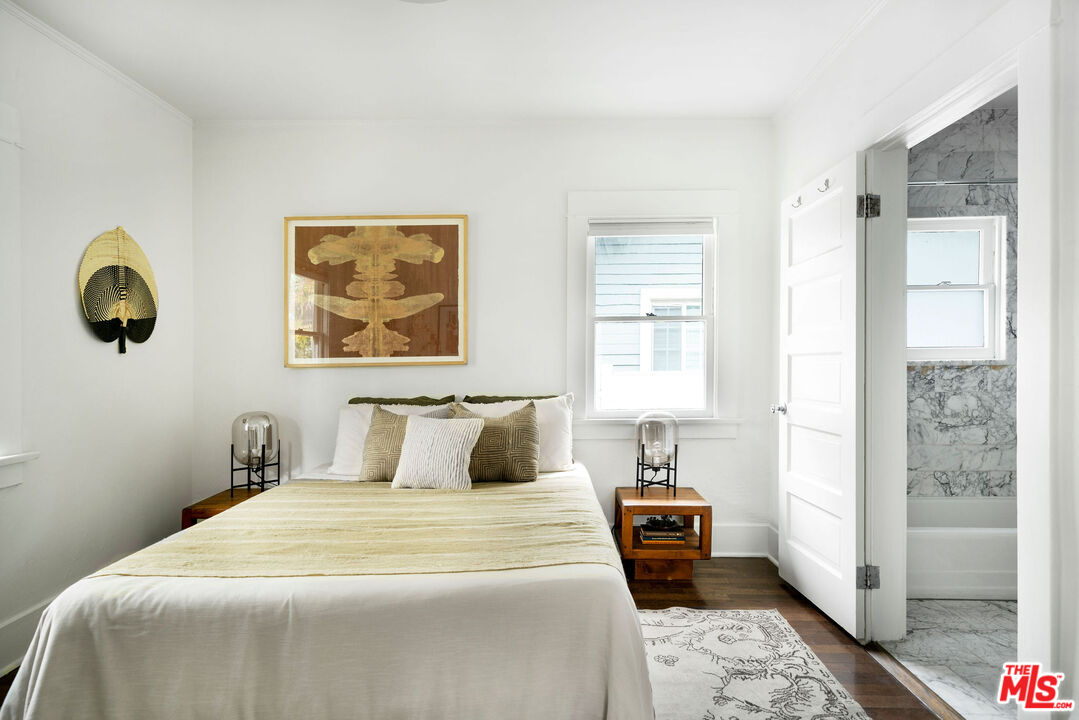 1205 Sanborn Avenue Los Angeles, CA 90029 - Photo 15 of 48 a bedroom with a large bed and a window