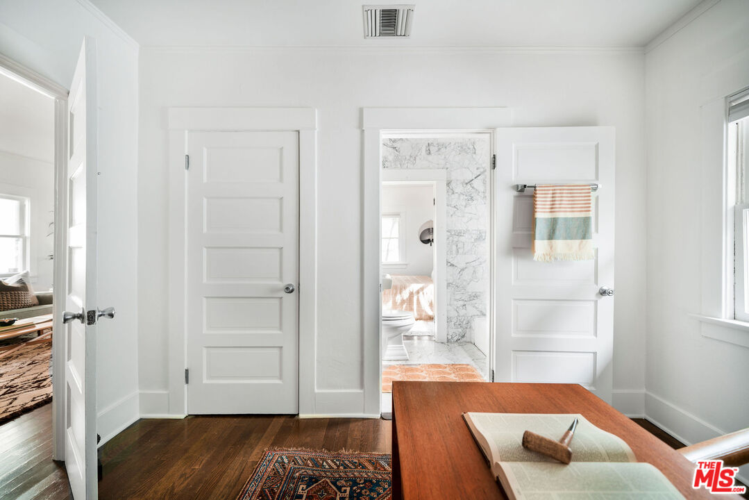 1205 Sanborn Avenue Los Angeles, CA 90029 - Photo 19 of 48 a bedroom with a bed and hardwood floor