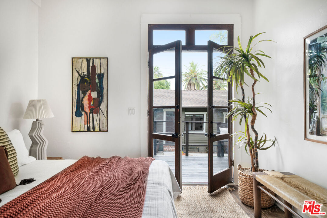 1205 Sanborn Avenue Los Angeles, CA 90029 - Photo 24 of 48 a bedroom with a bed and a window