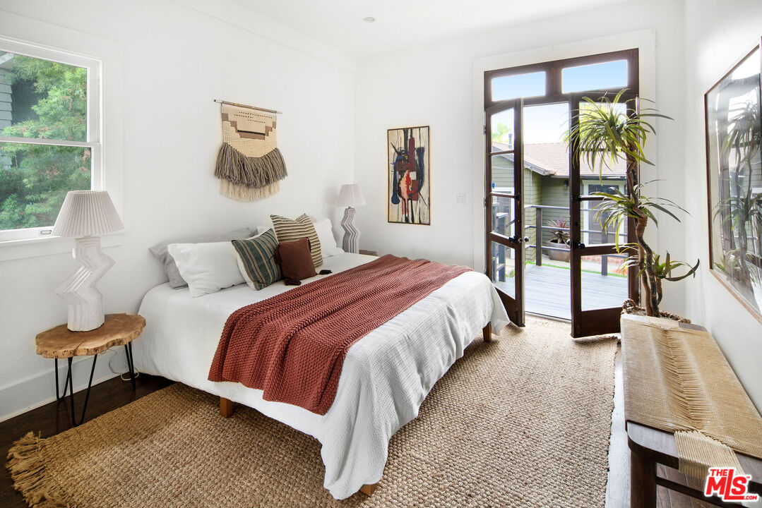 1205 Sanborn Avenue Los Angeles, CA 90029 - Photo 26 of 48 a bedroom with a bed and a large window