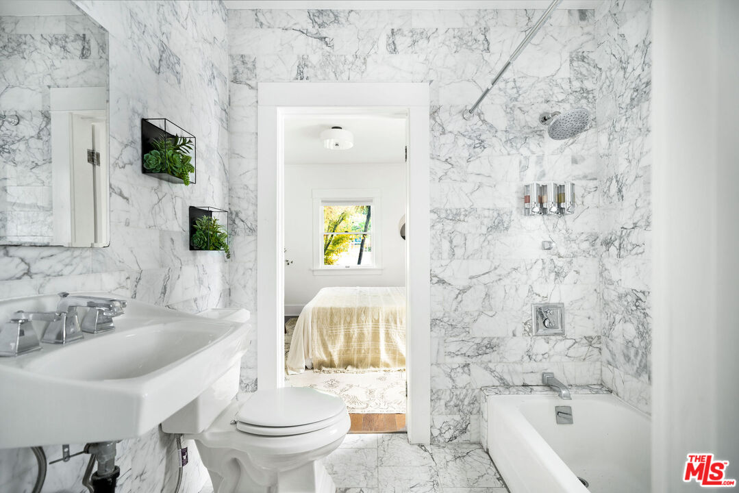 1205 Sanborn Avenue Los Angeles, CA 90029 - Photo 28 of 48 a bathroom with a sink toilet and shower