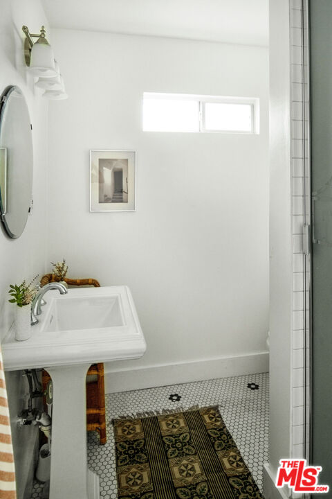 1205 Sanborn Avenue Los Angeles, CA 90029 - Photo 29 of 48 a bathroom with a sink and a mirror